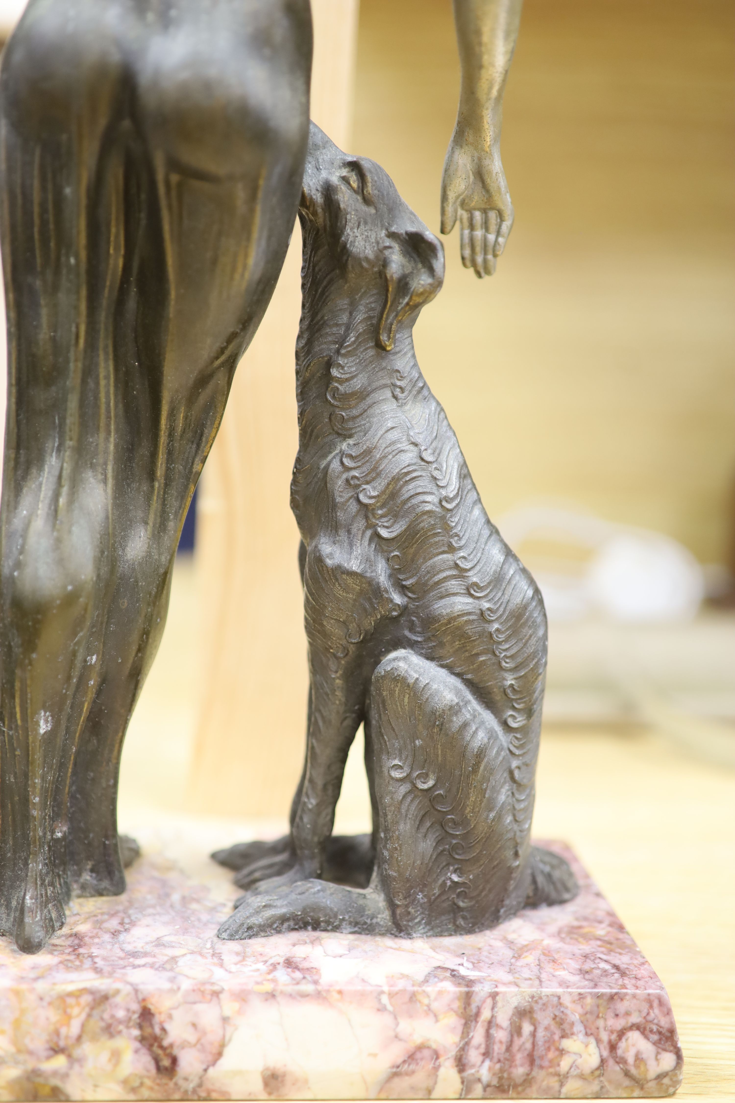 A Spelter Art Deco figure of a dog and borzoi, on a marble base, height 45cm